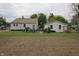 Large backyard with garden, wooden trellis, and well-maintained lawn at 2657 Mars Hill St, Indianapolis, IN 46241