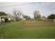 Lush backyard featuring a garden plot and mature trees at 2657 Mars Hill St, Indianapolis, IN 46241