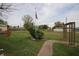 Well-maintained backyard with lush green grass and a decorative trellis feature at 2657 Mars Hill St, Indianapolis, IN 46241