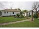Spacious backyard with a garden area and a charming wooden trellis at 2657 Mars Hill St, Indianapolis, IN 46241