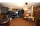 Basement is carpeted, with wood paneling, and plenty of room for activities at 2657 Mars Hill St, Indianapolis, IN 46241