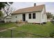 Charming home with white siding, a star decoration, and a chain link fence at 2657 Mars Hill St, Indianapolis, IN 46241