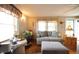 Comfortable living room with a plush couch, ottoman, and natural light streaming in through the windows at 2657 Mars Hill St, Indianapolis, IN 46241
