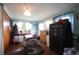 Well-lit office area with a large safe, hardwood flooring, and ample storage space at 2657 Mars Hill St, Indianapolis, IN 46241