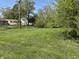 A large green backyard on a sunny day at 2842 Sangster Ave, Indianapolis, IN 46218