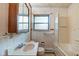 Bathroom with a tub/shower combo, toilet, and vanity with mirror at 2842 Sangster Ave, Indianapolis, IN 46218