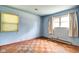 Bedroom showcasing hardwood floors and natural light from two windows at 2842 Sangster Ave, Indianapolis, IN 46218
