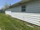 Side of a white house with green grass and a window at 2842 Sangster Ave, Indianapolis, IN 46218
