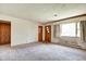 Spacious living room with natural light, carpet, and original features at 2842 Sangster Ave, Indianapolis, IN 46218