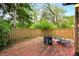 Fenced backyard featuring a portable cold pod, gravel area, and established perimeter plants at 3165 Sycamore Dr, Columbus, IN 47203