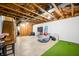 Spacious unfinished basement with exposed ceiling and indoor putting green for recreation at 3165 Sycamore Dr, Columbus, IN 47203