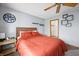 Comfortable bedroom with ceiling fan, warm colors, and a walk-in closet for ample storage at 3165 Sycamore Dr, Columbus, IN 47203