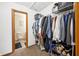 Walk-in closet with wire shelving full of clothes and storage, with a connected toilet room at 3165 Sycamore Dr, Columbus, IN 47203