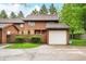 Charming two-story townhome featuring a detached garage and fenced front yard at 3165 Sycamore Dr, Columbus, IN 47203