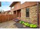 Exterior view of a townhome with stone accents and a well maintained front yard at 3165 Sycamore Dr, Columbus, IN 47203