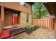 The front door of this townhome has stone accents and colorful landscaping at 3165 Sycamore Dr, Columbus, IN 47203