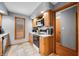 Bright kitchen with wood cabinetry, stainless steel microwave, and adjacent dining space at 3165 Sycamore Dr, Columbus, IN 47203