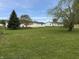 Large backyard with mature trees, offering a private and spacious outdoor area at 3209 Pebblebrook Dr, Elwood, IN 46036