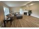 Inviting living room with wood floors, fireplace, and modern decor, offering a cozy atmosphere at 3209 Pebblebrook Dr, Elwood, IN 46036