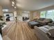 Open-concept living area showcasing flooring, natural light, and connection to the kitchen at 3209 Pebblebrook Dr, Elwood, IN 46036