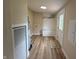 A well-lit mud room features durable flooring and built in storage, perfect for seamless organization at 3209 Pebblebrook Dr, Elwood, IN 46036