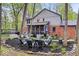 Beautiful backyard oasis with mature trees and fire pit at 3444 Briar Pl, Carmel, IN 46033