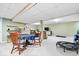 Open basement area with table, chairs and recreation area at 3444 Briar Pl, Carmel, IN 46033