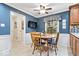 Charming breakfast nook featuring a wood table, matching chairs, wainscoting, and natural light at 3444 Briar Pl, Carmel, IN 46033