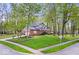 Charming two-story home with a well-manicured lawn and beautiful landscaping at 3444 Briar Pl, Carmel, IN 46033