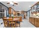 Traditional kitchen with granite countertops, stainless appliances, and wood cabinetry and a cozy breakfast nook at 3444 Briar Pl, Carmel, IN 46033