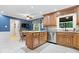 Well-lit kitchen with wood cabinets, stainless steel appliances, and granite countertops. Cozy breakfast nook near the window at 3444 Briar Pl, Carmel, IN 46033
