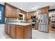 Spacious kitchen featuring granite countertops, stainless steel appliances, and beautiful wooden cabinetry at 3444 Briar Pl, Carmel, IN 46033