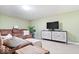 Comfortable living room featuring plush seating, modern TV console, and neutral tones at 3444 Briar Pl, Carmel, IN 46033