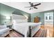 Spacious main bedroom with a plush bed, hardwood floors, and an ensuite bathroom at 3444 Briar Pl, Carmel, IN 46033
