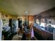 Kitchen features outdated cabinets and a stainless steel refrigerator at 3602 E 22Nd St, Indianapolis, IN 46218