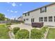 Inviting backyard with manicured shrubs, and a hot tub on a concrete patio, ideal for relaxation and outdoor enjoyment at 3652 Newberry Rd, Plainfield, IN 46168