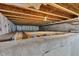 Unfinished basement featuring exposed beams, insulation, and a concrete foundation at 3652 Newberry Rd, Plainfield, IN 46168