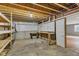 Unfinished basement with concrete floor, workbench, pegboard, shelves and visible piping at 3652 Newberry Rd, Plainfield, IN 46168