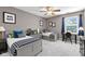 Well-lit bedroom with two beds, ample lighting, and a bright window at 3652 Newberry Rd, Plainfield, IN 46168