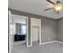 Bedroom showcasing neutral walls, carpet flooring, fan and access to closet and living space at 3652 Newberry Rd, Plainfield, IN 46168