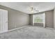 Bedroom featuring carpet floors, neutral walls, ceiling fan, and a window with curtains at 3652 Newberry Rd, Plainfield, IN 46168