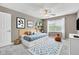 Comfortable bedroom features a fan, neutral colors, bright windows, and ample lighting at 3652 Newberry Rd, Plainfield, IN 46168