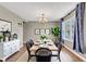 Elegant dining room featuring a chandelier, hardwood floors, and bright window at 3652 Newberry Rd, Plainfield, IN 46168