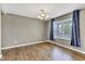 Cozy dining room with wood floors, chandelier, and window at 3652 Newberry Rd, Plainfield, IN 46168