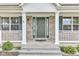 Attractive front entrance with an olive-green door, glass side panels, and white trim enhancing curb appeal at 3652 Newberry Rd, Plainfield, IN 46168