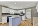 Kitchen featuring an island, stainless steel appliances, granite counters, and modern fixtures at 3652 Newberry Rd, Plainfield, IN 46168