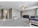 Comfortable living room with plush carpeting, ceiling fan, and plenty of space at 3652 Newberry Rd, Plainfield, IN 46168