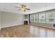 Bright living room with fireplace, windows, and wood floors at 3652 Newberry Rd, Plainfield, IN 46168