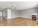 Spacious living room with fireplace, wood floors, and white trim at 3652 Newberry Rd, Plainfield, IN 46168