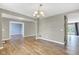 Large living room featuring hardwood flooring, neutral paint, and natural lighting at 3652 Newberry Rd, Plainfield, IN 46168